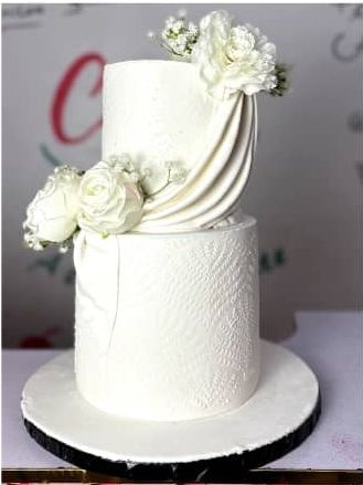 Two-tier wedding cake from a Cakes by Sadee package